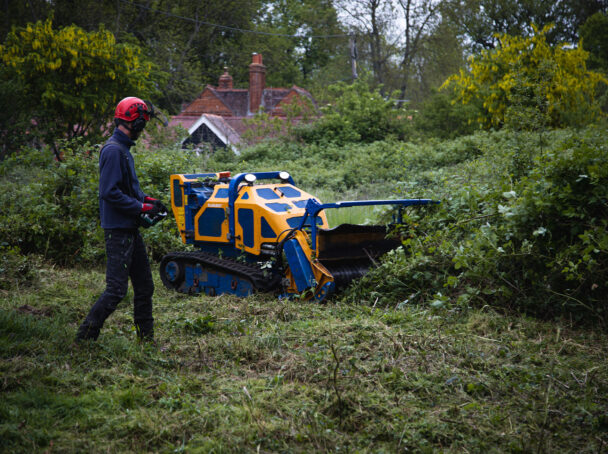 Hedgecutter head on Flailbot making easy work through thick vegetation