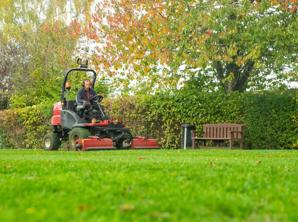 Using our ride-on lawn mower to maintain the school grounds