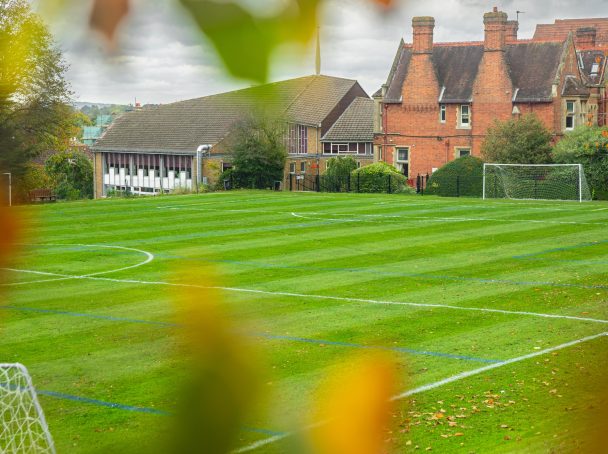 Mowing neat stripes into a school football pitch